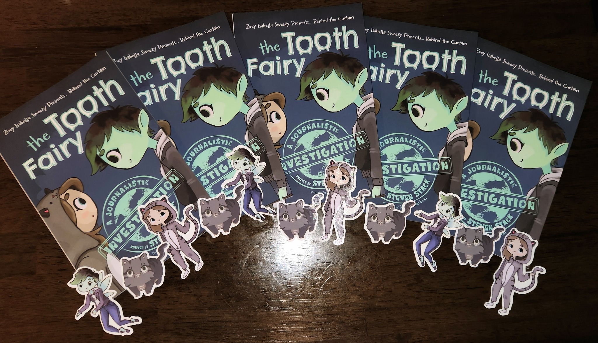 Several Tooth Fairy books with stickers along bottom