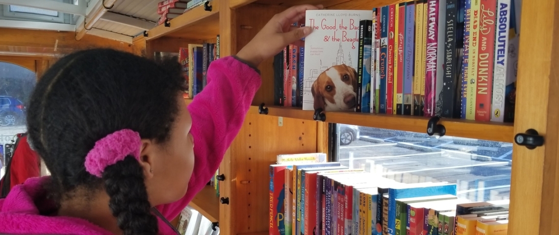 Girl browsing shelf